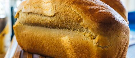 A loaf of bread on a wooden surface.