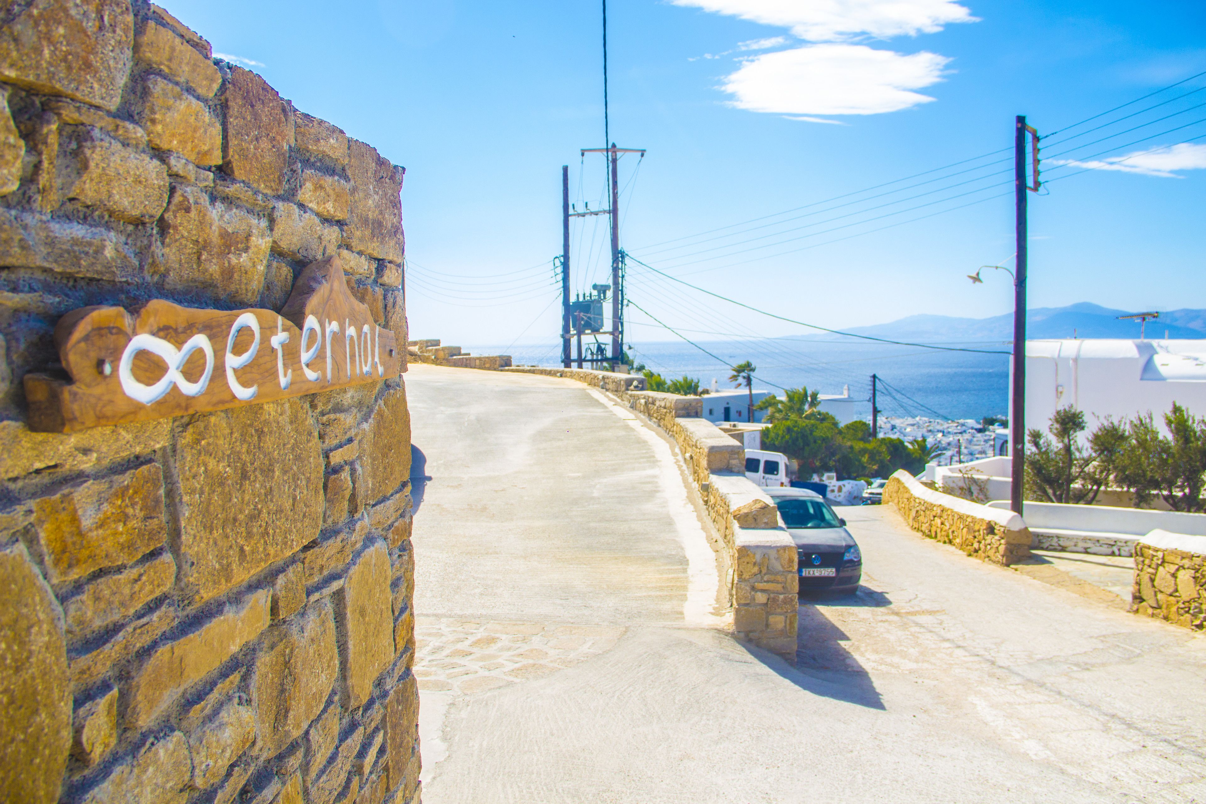 A stone wall with a sign reading "Eterna".