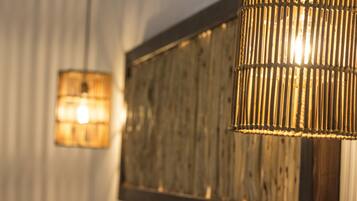 A room with a wooden wall panel and a hanging light fixture.
