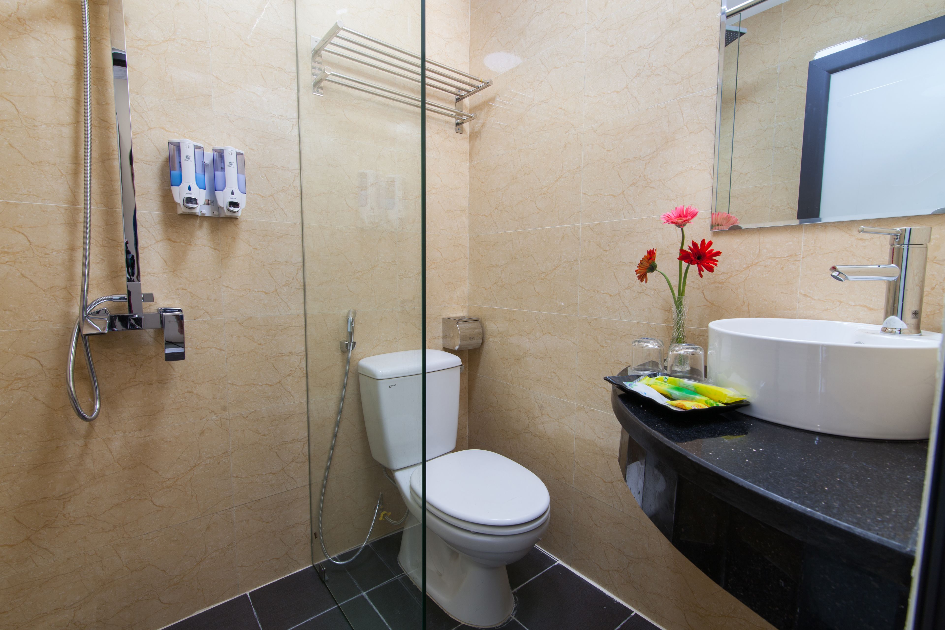 junior suite, 1 queen bed, balcony, city view | bathroom | shower, free toiletries, hair dryer, bathrobes