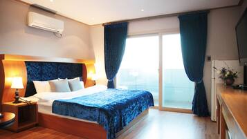 Habitación doble Deluxe | 1 habitación, escritorio, cortinas blackout y insonorización