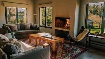 Family Suite, 1 Bedroom, Kitchen, Garden View | Living area | Flat-screen TV, fireplace