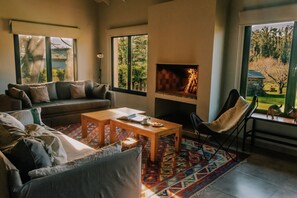 Family Suite, 1 Bedroom, Kitchen, Garden View | Living area | Flat-screen TV, fireplace