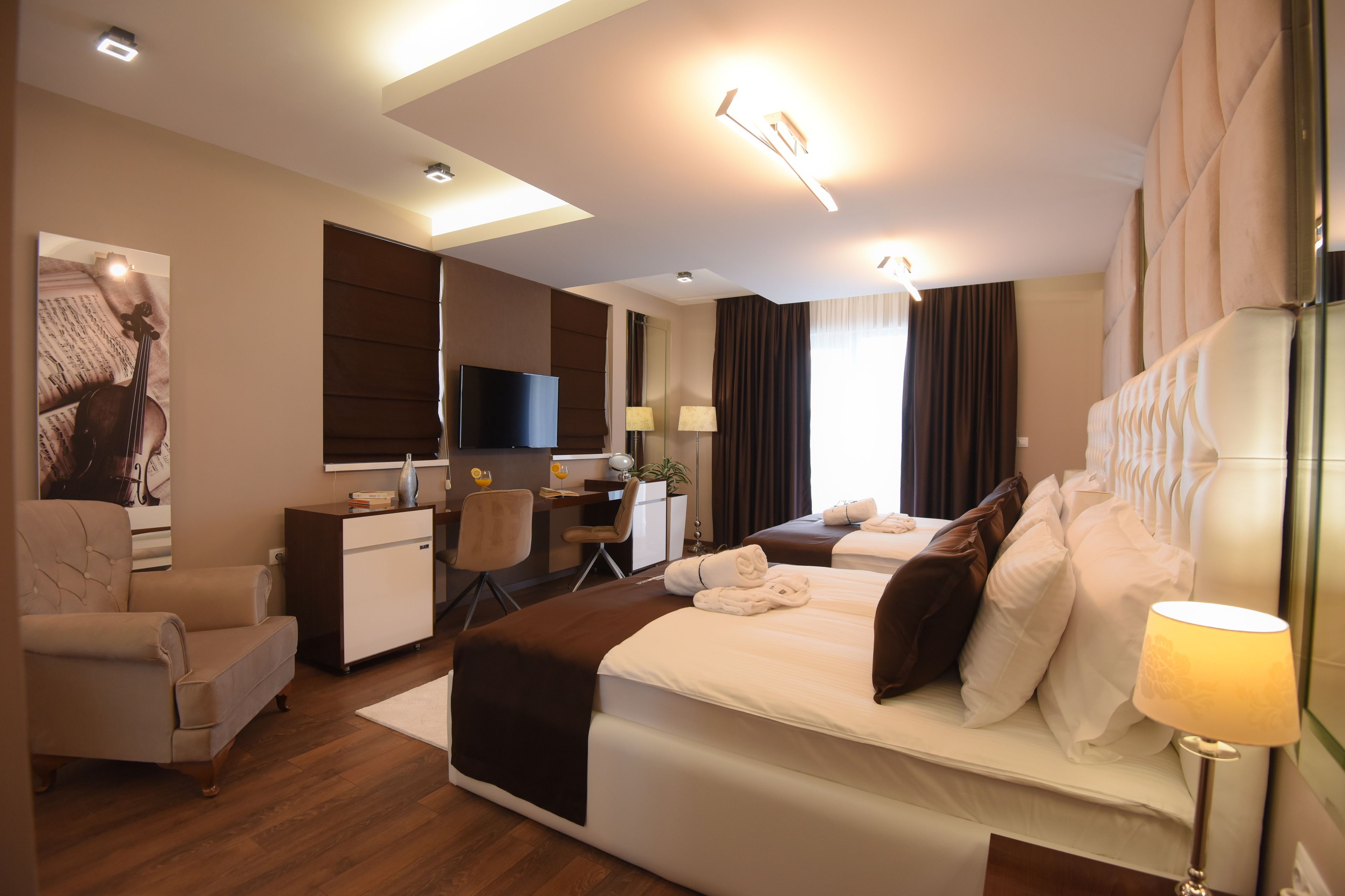 deluxe family room  | premium bedding, minibar, in-room safe, laptop workspace