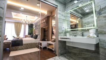 Junior Suite, 1 King Bed | Bathroom | Shower, free toiletries, hair dryer, bathrobes