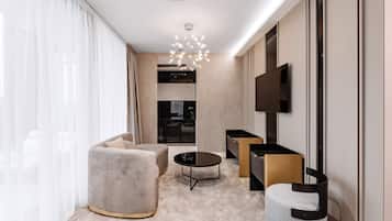 Signature Suite, 1 Queen Bed, Jetted Tub, Pool View | Living area | Flat-screen TV