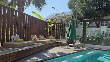 Seasonal outdoor pool, pool umbrellas, pool loungers