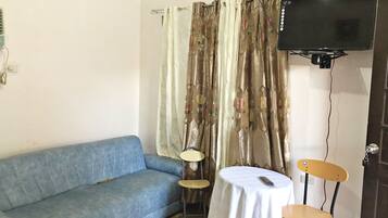 Double Room | Living area | Flat-screen TV