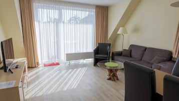 Apartment, 2 Bedrooms | Living area | 25-inch flat-screen TV with satellite channels