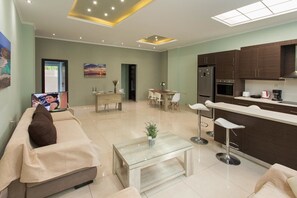 Luxury Apartment | Living room | Flat-screen TV, video game console - Creta Nostos Luxury Apartment (Chania)