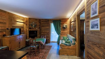 Luxury Apartment | Living room | 32-inch LCD TV with digital channels, TV, heated floors