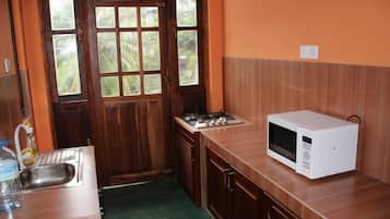 Fridge, microwave, cookware/dishes/utensils