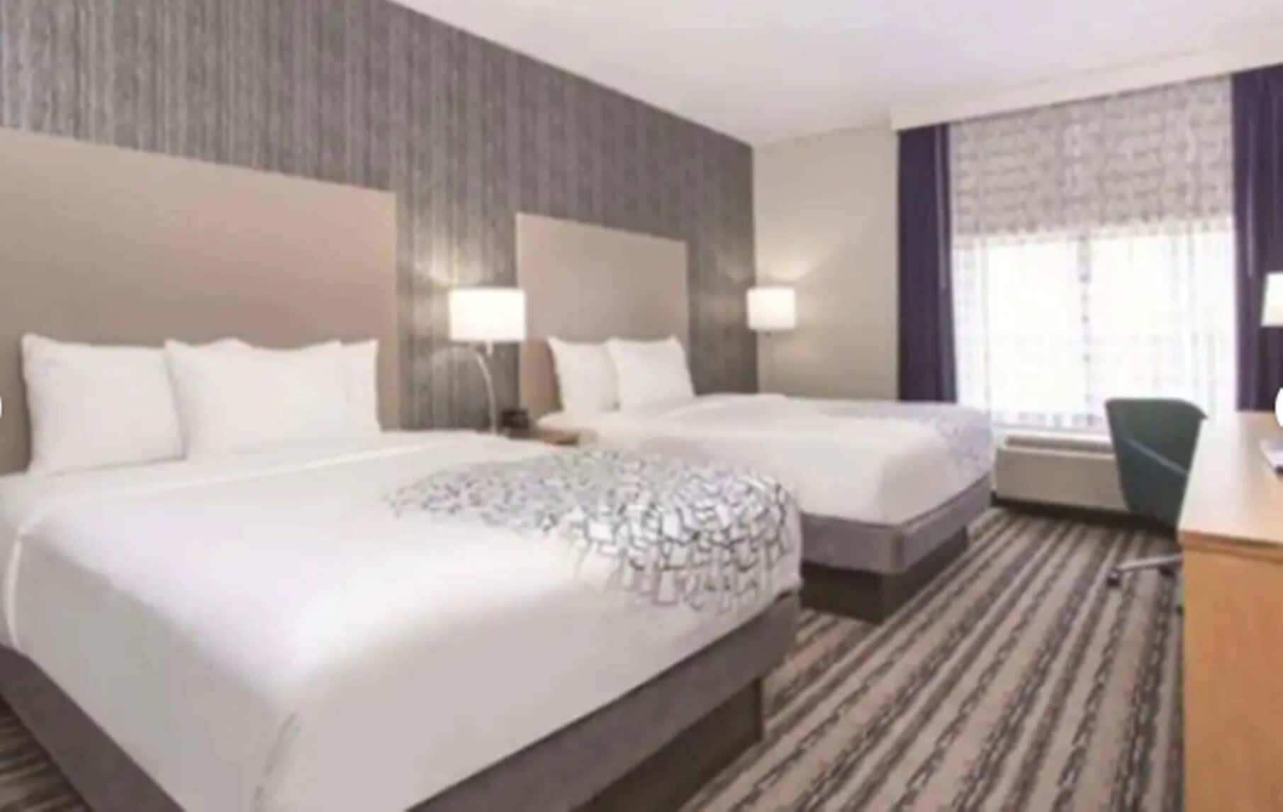 Premium bedding, pillowtop beds, desk, blackout drapes