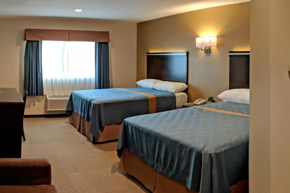 2 queen beds | desk, blackout curtains, iron/ironing board, free wifi