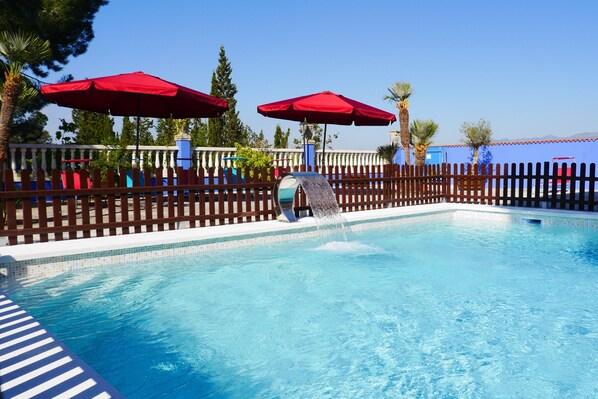 Outdoor pool, pool umbrellas, pool loungers