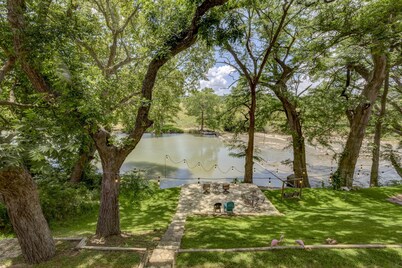 Scenic riverfront home on quiet stretch of Guadalupe - waterfall by front porch