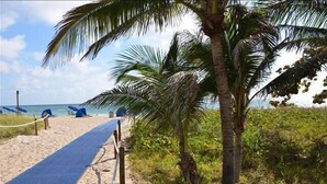 A beach path with palm trees and beach chairs. - BY THE SEA VACATION VILLAS 5 BED WATERFRONT/ POOL LARGE ESTATE NEAR BEACH (Pompano Beach,)