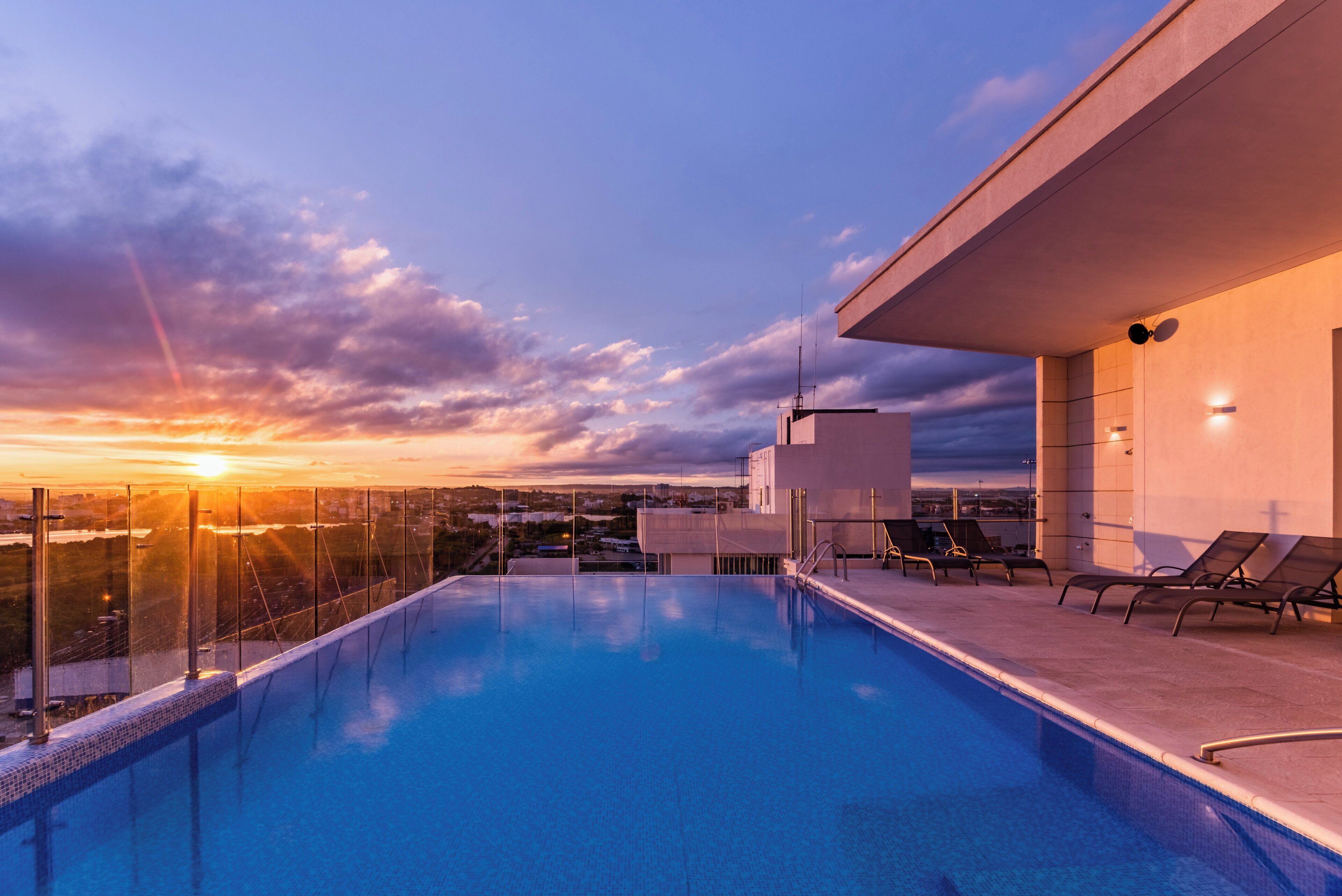 Outdoor pool, open 8:00 AM to 8:00 PM, pool loungers