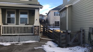 A residential area with houses, a concrete pathway, and a wooden fence. - A Fabulous home in the Rocky Mountain State (Centennial)
