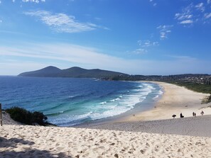 On the beach, sun-loungers