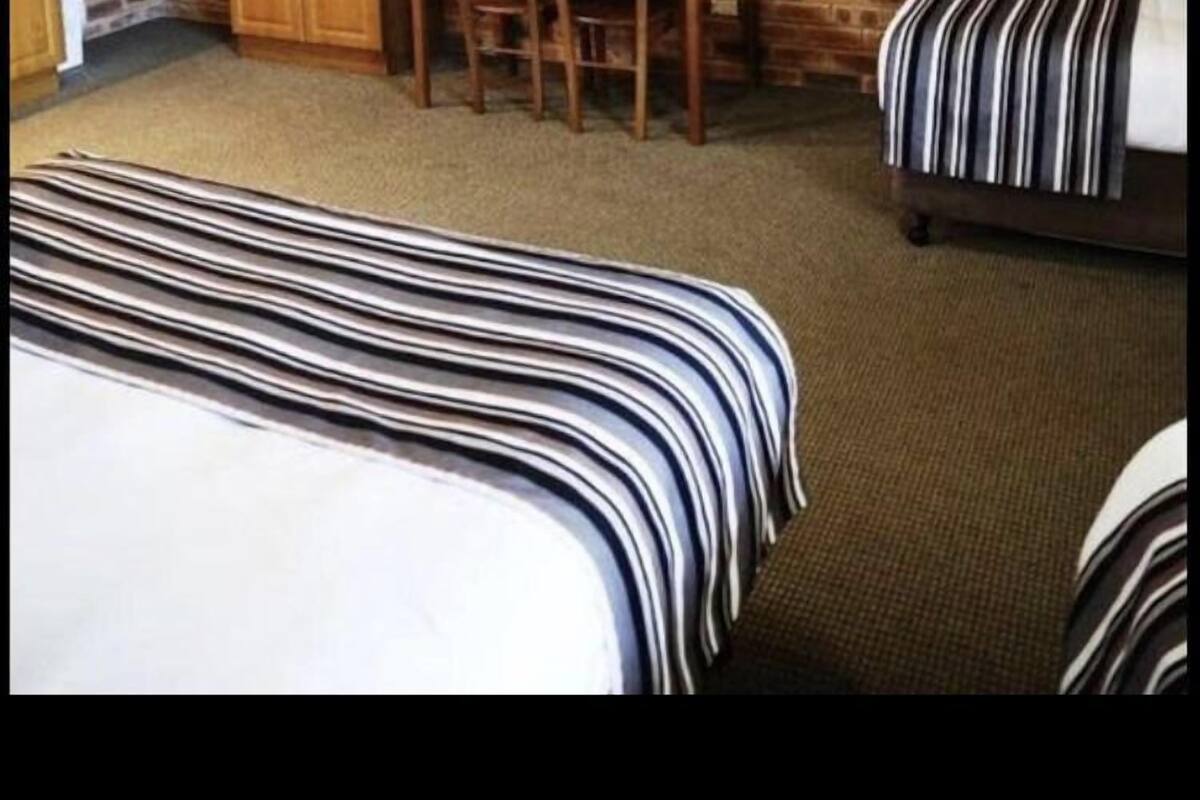 Deluxe Family Room | Minibar, in-room safe, iron/ironing board, free WiFi