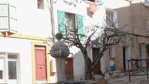 A fountain with a plaque reading "Fontaine et Lavoir St Jean 1850" in a public square. - In the heart of nature, a welcoming nest with swimming pool to recharge your batteries (Barjols)