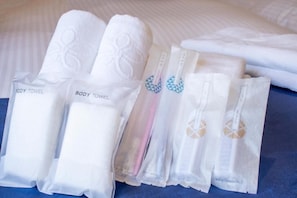 A set of neatly folded towels with labels, including "BODY TOWEL" and "Bath Spa." - Stay SAKURA Kyoto ZEN (Kyoto)