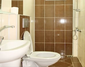 Shower, hair dryer, slippers, towels