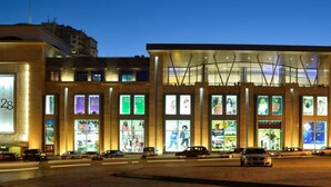 A modern building with large windows and a central atrium. - Hotel 28 (Baku)