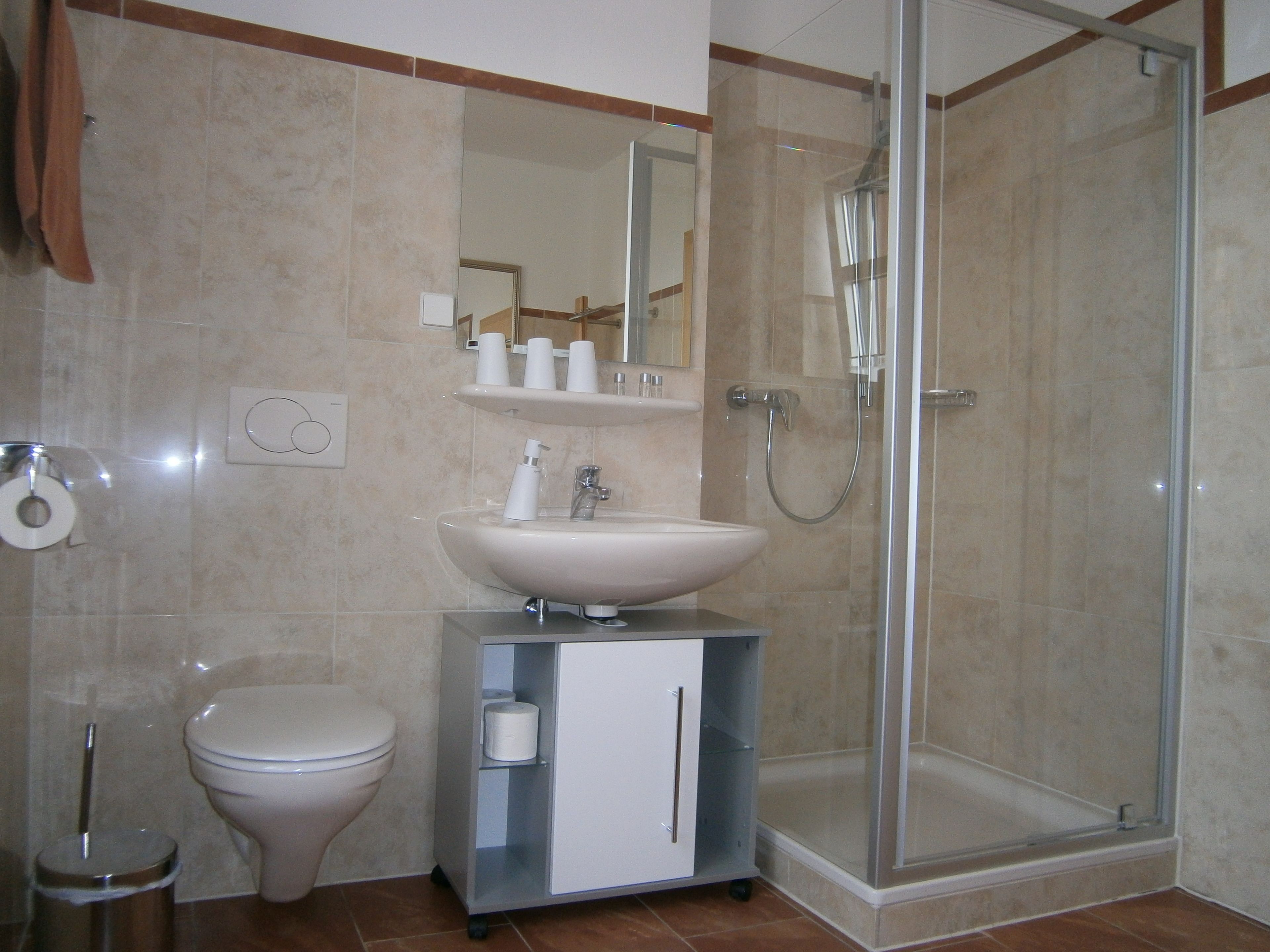 comfort triple room, non smoking, private bathroom | bathroom | rainfall showerhead, hair dryer, towels, soap