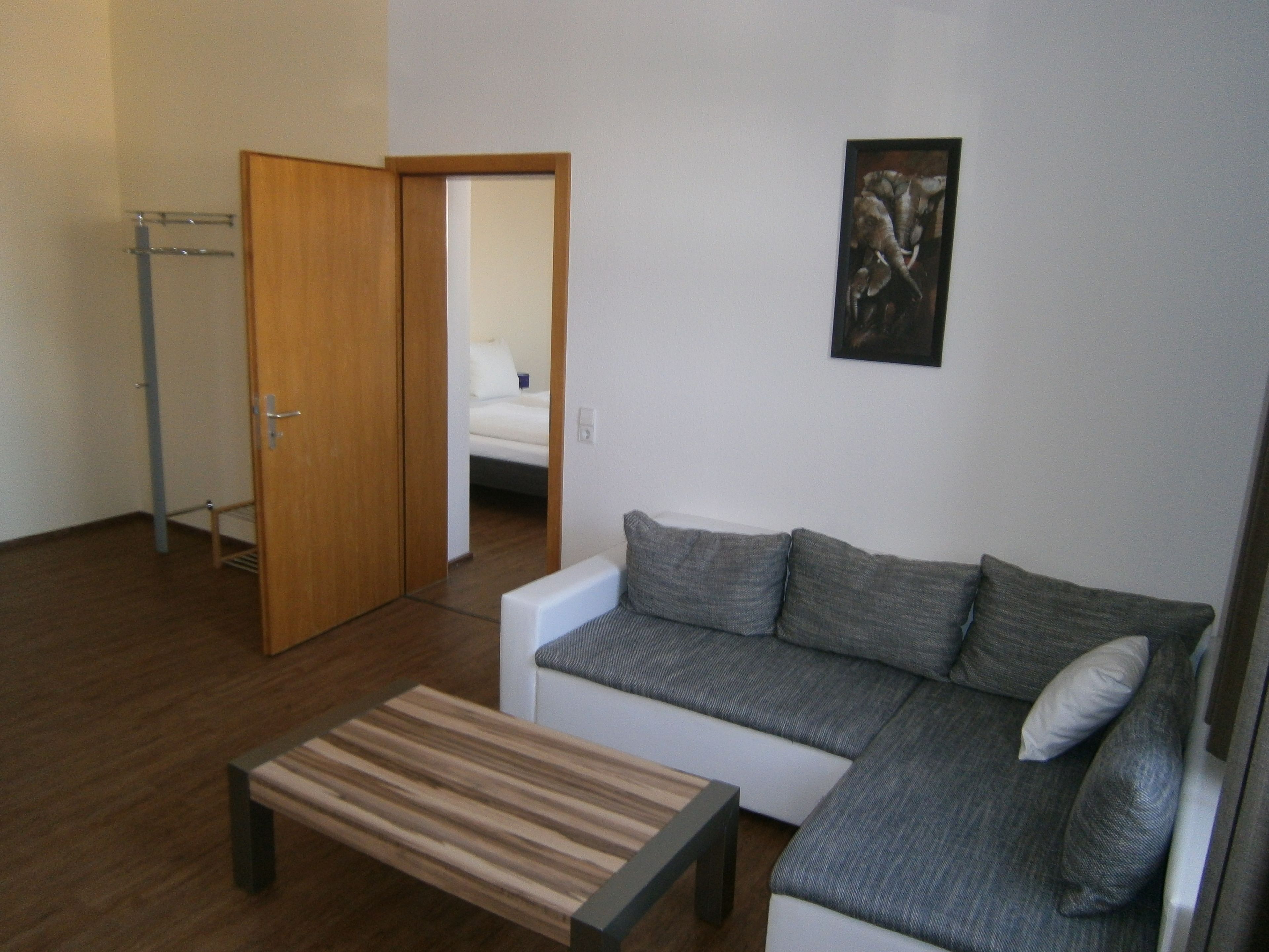 deluxe apartment, non smoking, kitchen | living area | flat-screen tv