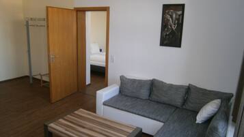 Departamento Deluxe, para no fumadores, cocina | Área de sala de estar | Televisión de pantalla plana