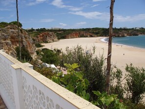On the beach, sun-loungers