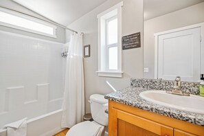 Combined shower/bathtub, hair dryer, towels, soap