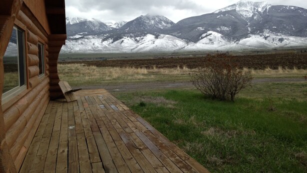 A wooden cabin with a deck overlooking a snowy mountain range. - Peaceful, Mountain Setting.  Yellowstone Country. (Livingston)
