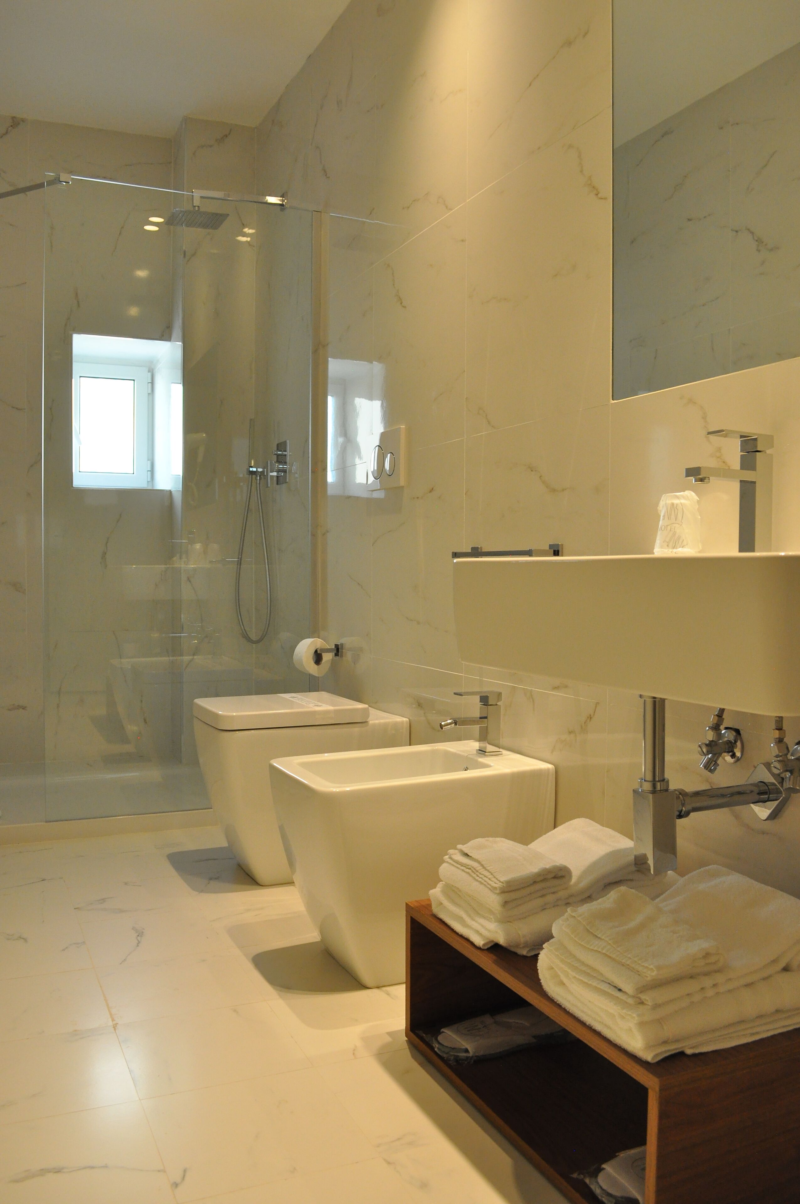 deluxe room | bathroom | shower, hair dryer, bathrobes, slippers