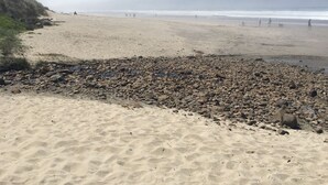 A beach with a rocky foreground and a sandy shore. - 3 Bedroom Haven By The Sea w/ beautiful ocean views & 2 Masters Sleeps 10 (Lincoln City)
