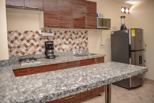 Microwave, coffee/tea maker, cookware/dishes/utensils
