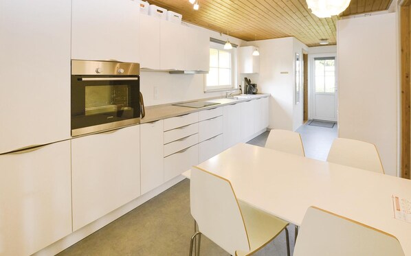 Fridge, stovetop, dishwasher, coffee/tea maker