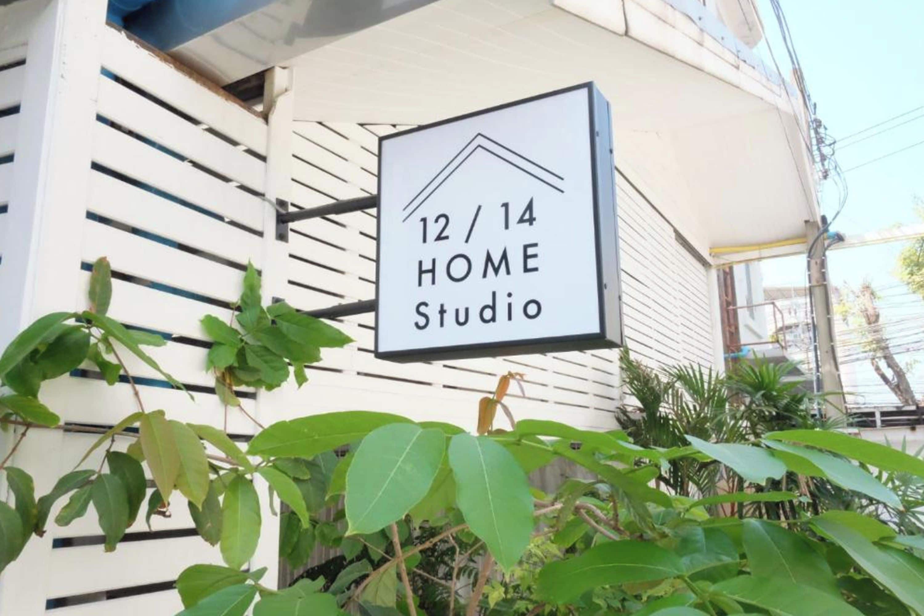 A sign for a studio apartment with the number 12/14, indicating the apartment number.