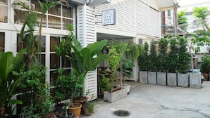 A residential building with a sign indicating "12/14 Home Studio". - 12/14 HOME Studio (Bangkok)