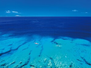 An aerial view of a clear blue sea with two kayaks. - ZOE RESORT THE Sunset Village OKINAWA CHATAN (Chatan)