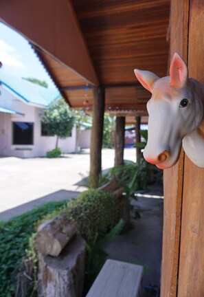 A wooden structure with a decorative horse head.