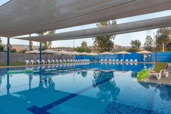 Outdoor pool, open 11:00 AM to 5:00 PM, pool loungers
