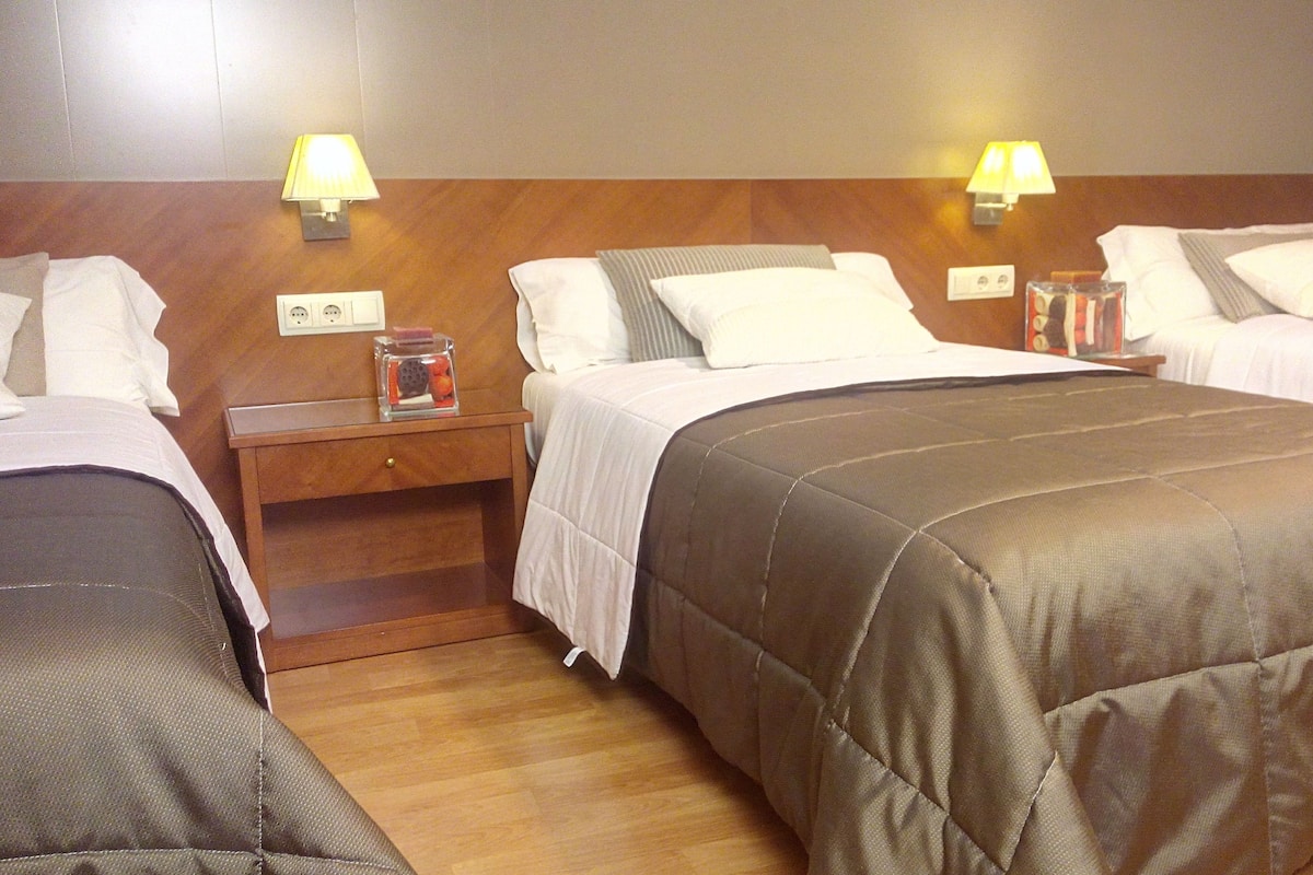 Premium bedding, desk, iron/ironing board, free cots/infant beds