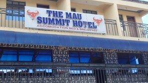 A hotel sign with the name "The Mau Summit Hotel" and mentions accommodation, bed, and breakfast services. - Mau Summit Hotel (Narok)