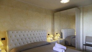 Villa, 2 Bedrooms | 2 bedrooms, iron/ironing board (on request), cots/infant beds - ARIA DI VACANZA - BARBAGIA COD.23 (Loiri Porto San Paolo)