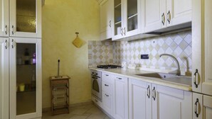Villa, 2 Bedrooms | Private kitchen | Full-sized fridge, oven, stovetop, cookware/dishes/utensils - ARIA DI VACANZA - BARBAGIA COD.23 (Loiri Porto San Paolo)