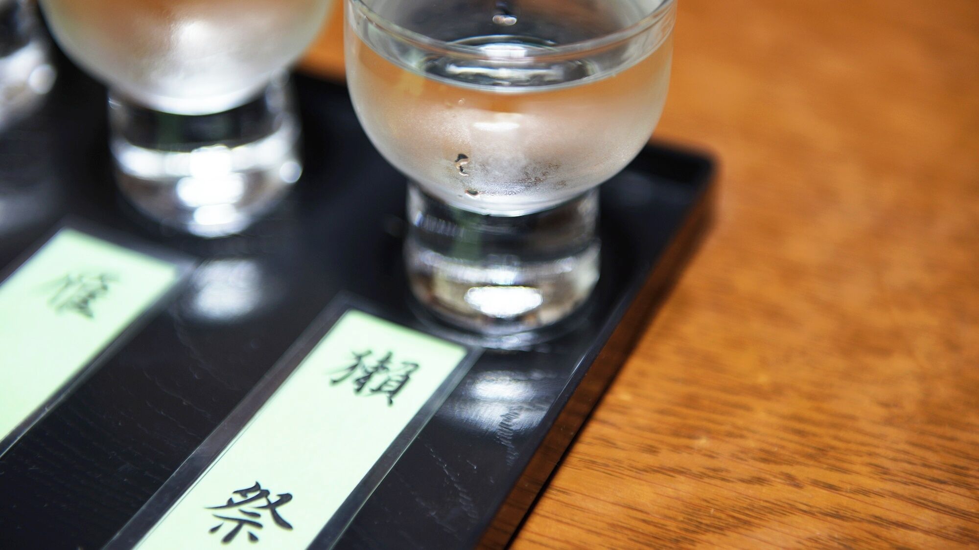 A scale with Japanese characters and a glass container.