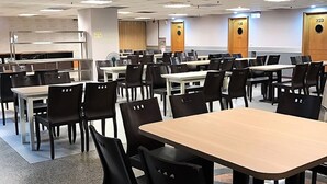 A spacious cafeteria with multiple tables and chairs, equipped with ceiling fans and recessed lighting. - Nanka Express Hotel (Chiayi City)